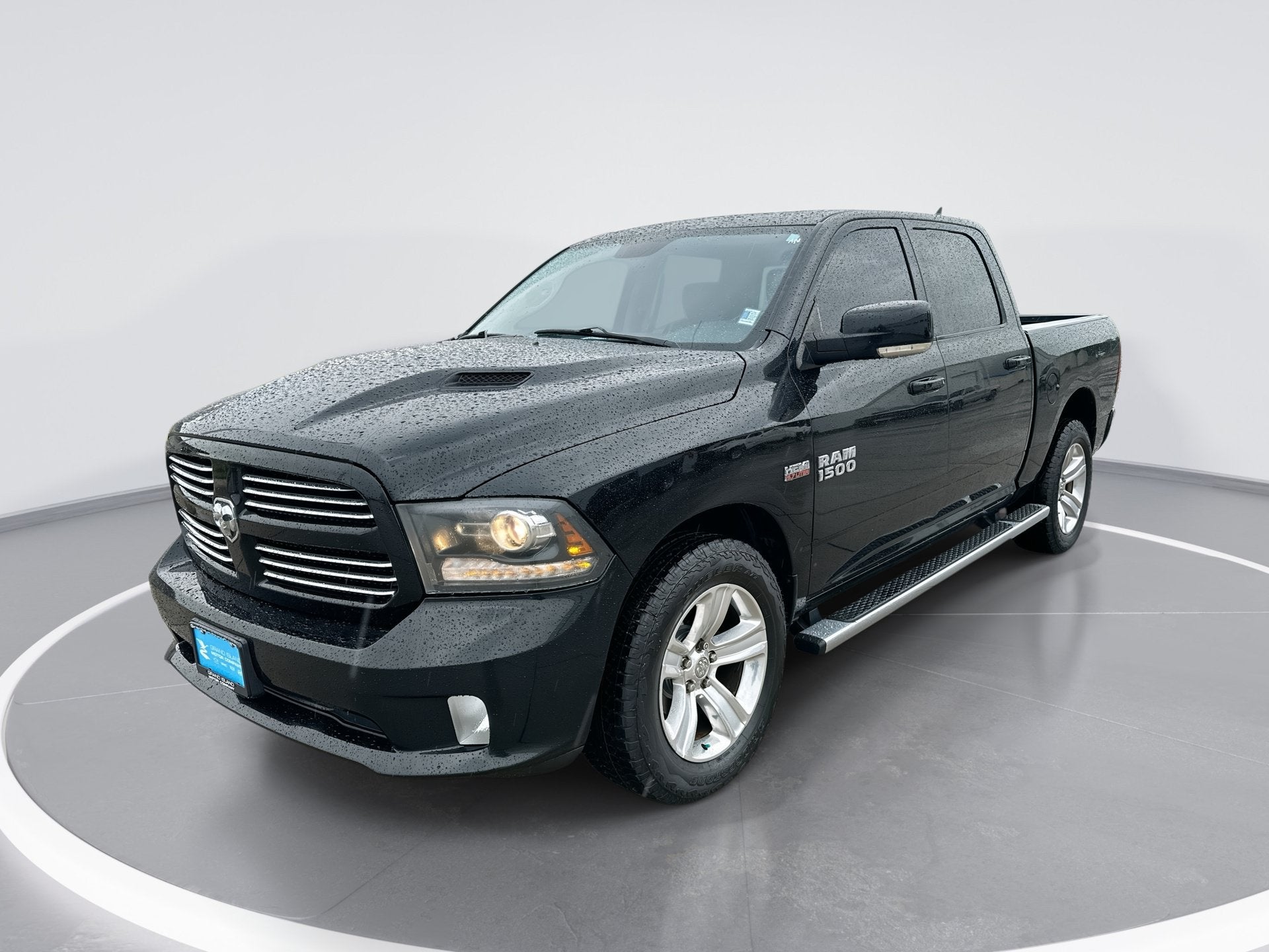 2013 RAM 1500 Sport in Black Clearcoat — front three-quarter view