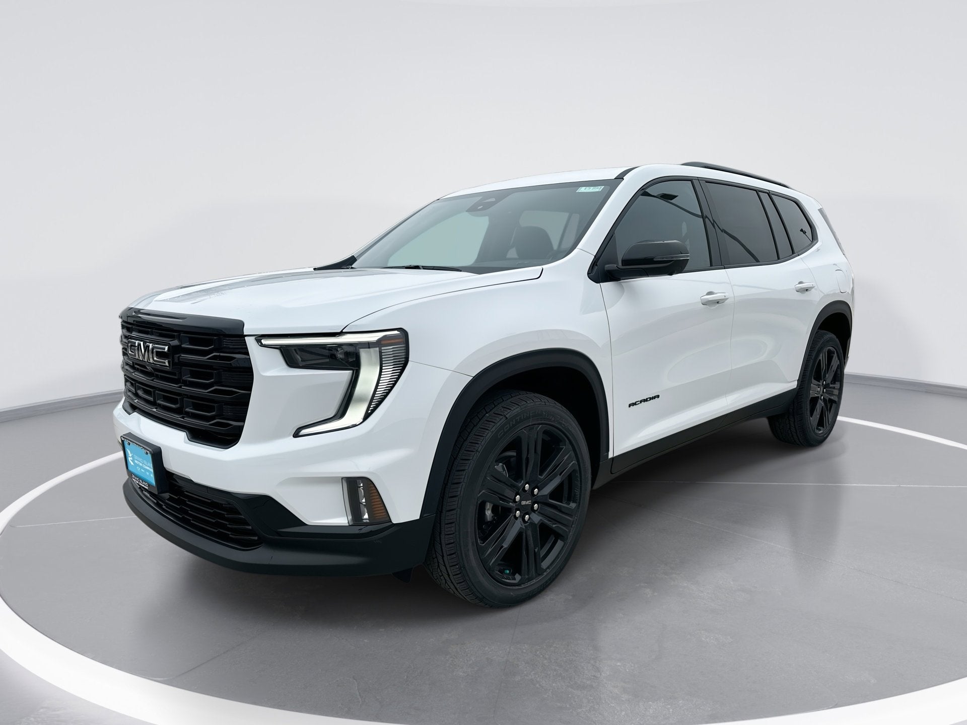 2026 GMC Acadia Elevation in Summit White — front three-quarter view