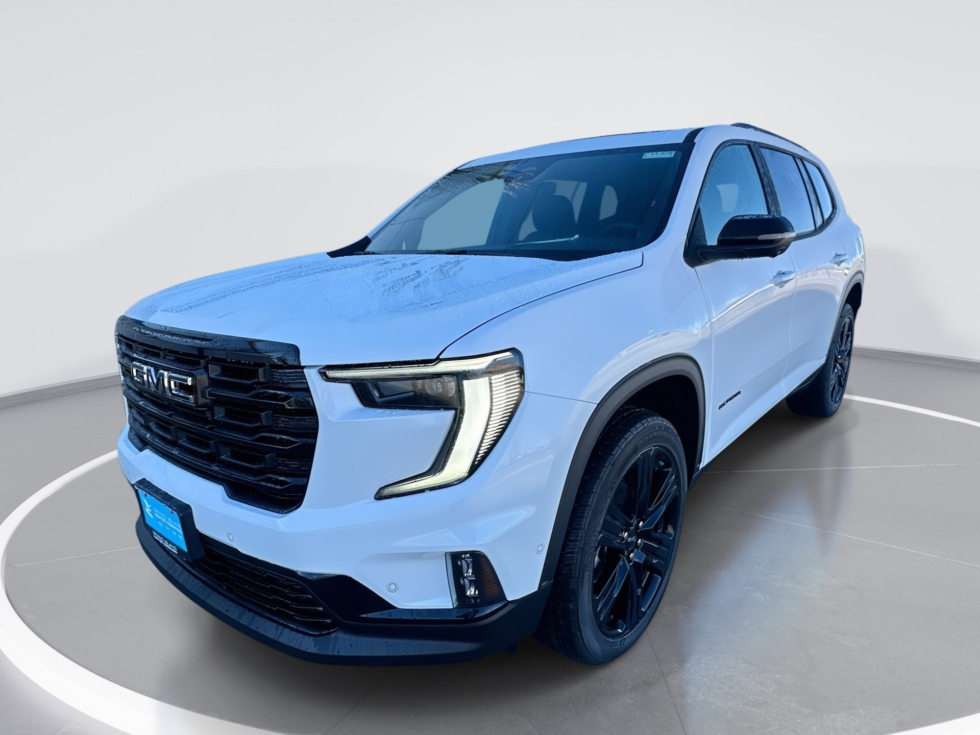 2026 GMC Acadia Elevation in Summit White — front three-quarter view