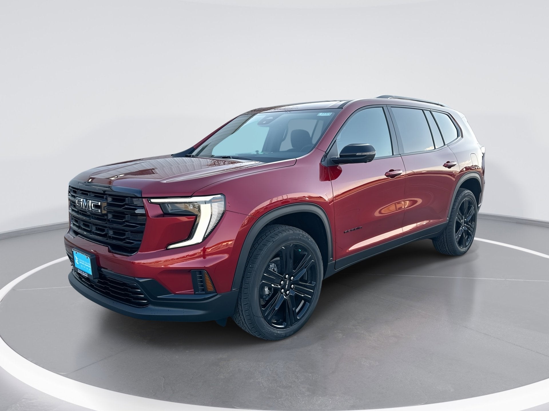 2026 GMC Acadia Elevation in Volcanic Red Tintcoat — front three-quarter view