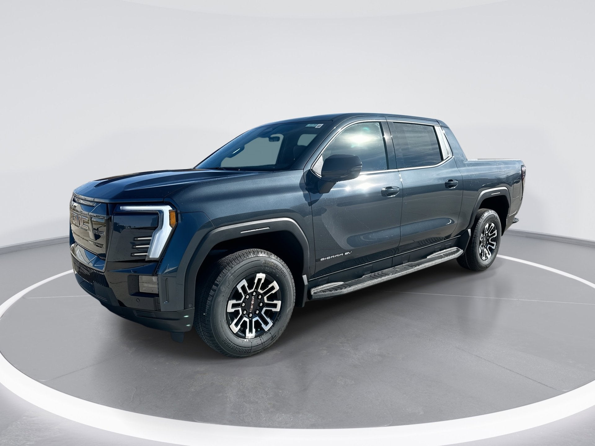 2026 GMC Sierra EV Elevation Extended Range in Deep Ocean Metallic — front three-quarter view