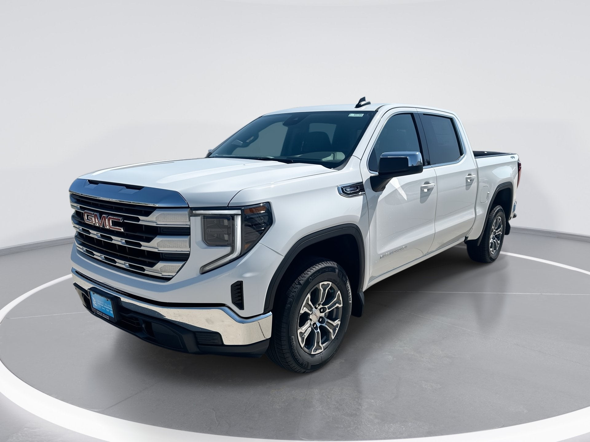 2026 GMC Sierra 1500 SLE in Summit White — front three-quarter view