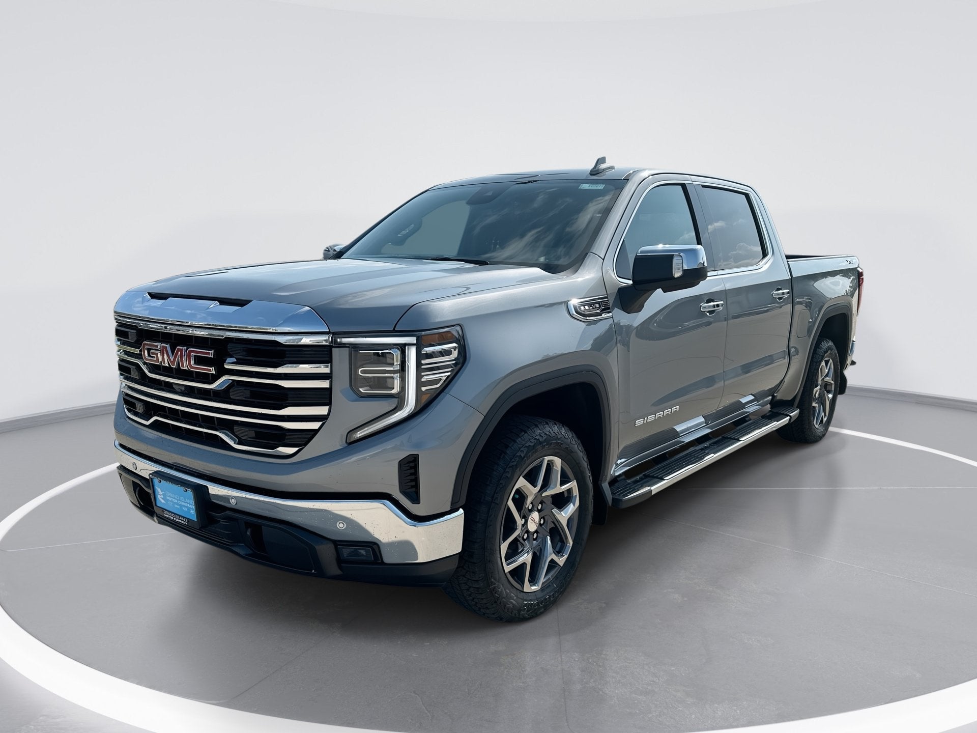 2026 GMC Sierra 1500 SLT in Sterling Metallic — front three-quarter view