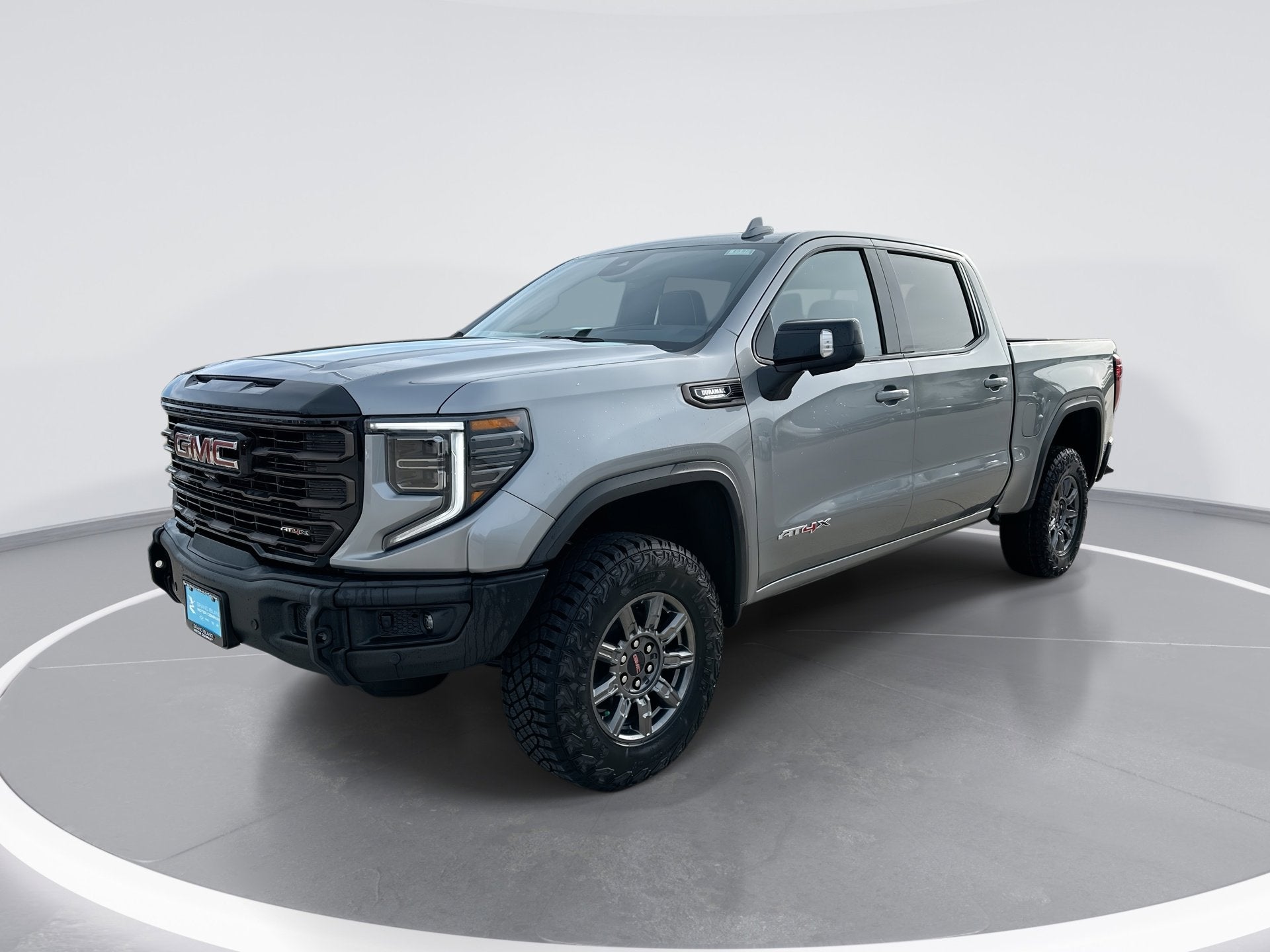 2026 GMC Sierra 1500 AT4X in Sterling Metallic — front three-quarter view